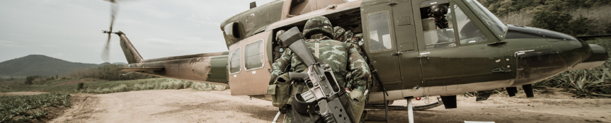 military individuals getting into helicopter